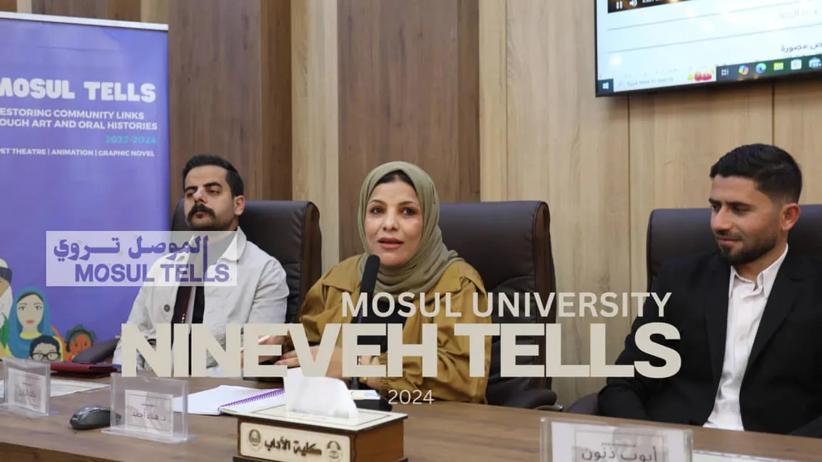 A woman speaks into a microphone between two men at a panel event, with a banner reading "MOSUL TELLS" and overlaid text "MOSUL UNIVERSITY NINEVEH TELLS 2024".