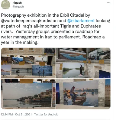 Screenshot of a tweet by "niqash" describing a photography exhibition in the Erbil Citadel, with four photos of river landscapes and boats displayed outdoors.