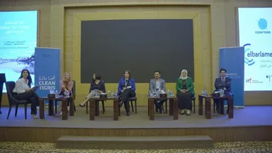 Seven panelists sit on a stage between screens reading "Water for Future" and "Clean Tigris", with an "elbarlament" banner in the background.