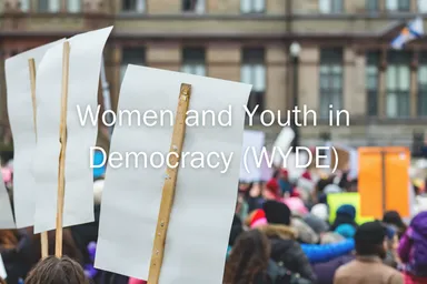 Protest signs held above a crowd outside a building, with overlaid text reading "Women and Youth in Democracy (WYDE)".
